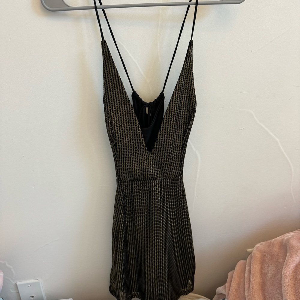 short black and gold v neck dress with open back